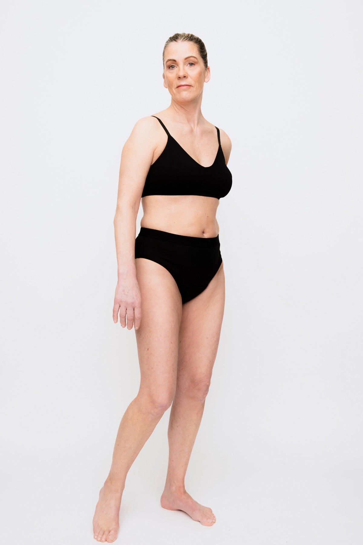 444 Studios Ultra incontinence underwear for women on model, briefs, 90 ml, black, front view, distance