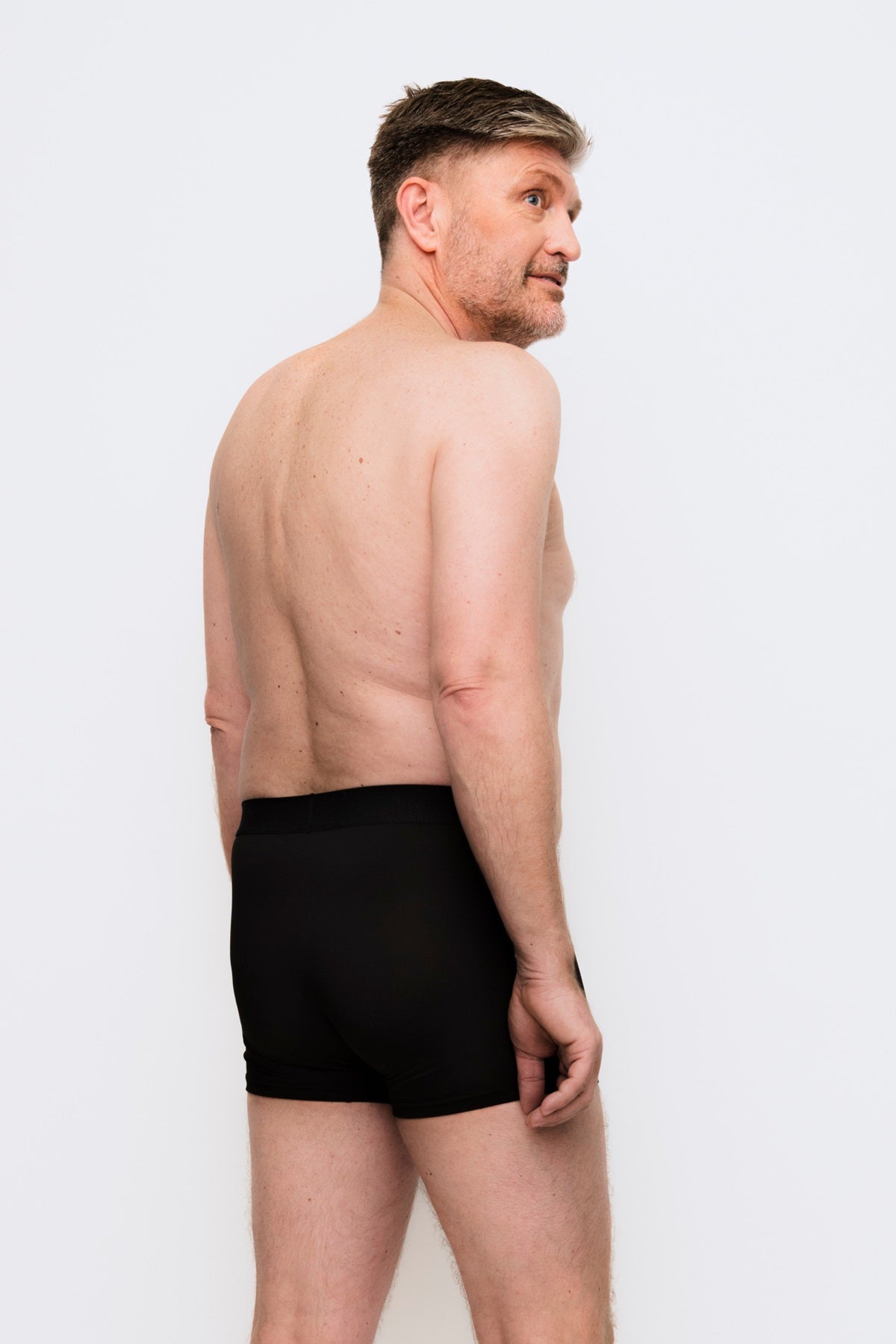 444 Studios Ultra incontinence underwear for men on model, boxers, 90 ml, black, from behind